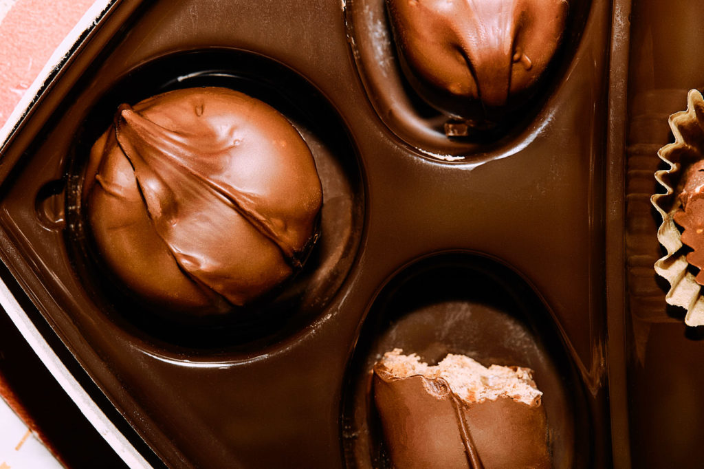 Close up of chocolate candy in carton